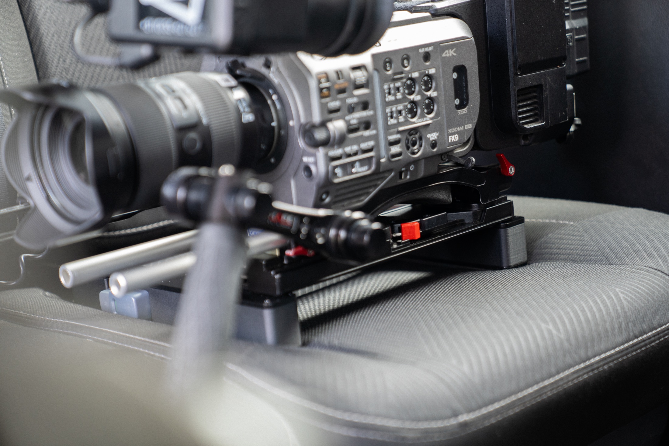 A fully rigged camera mounted on The Gearseat in a car seat