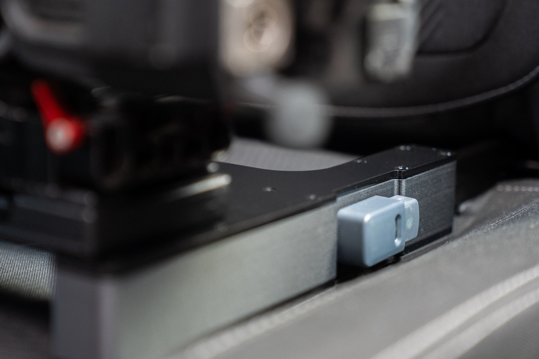 Close-up of The Gearseat latch and release detail inside a vehicle