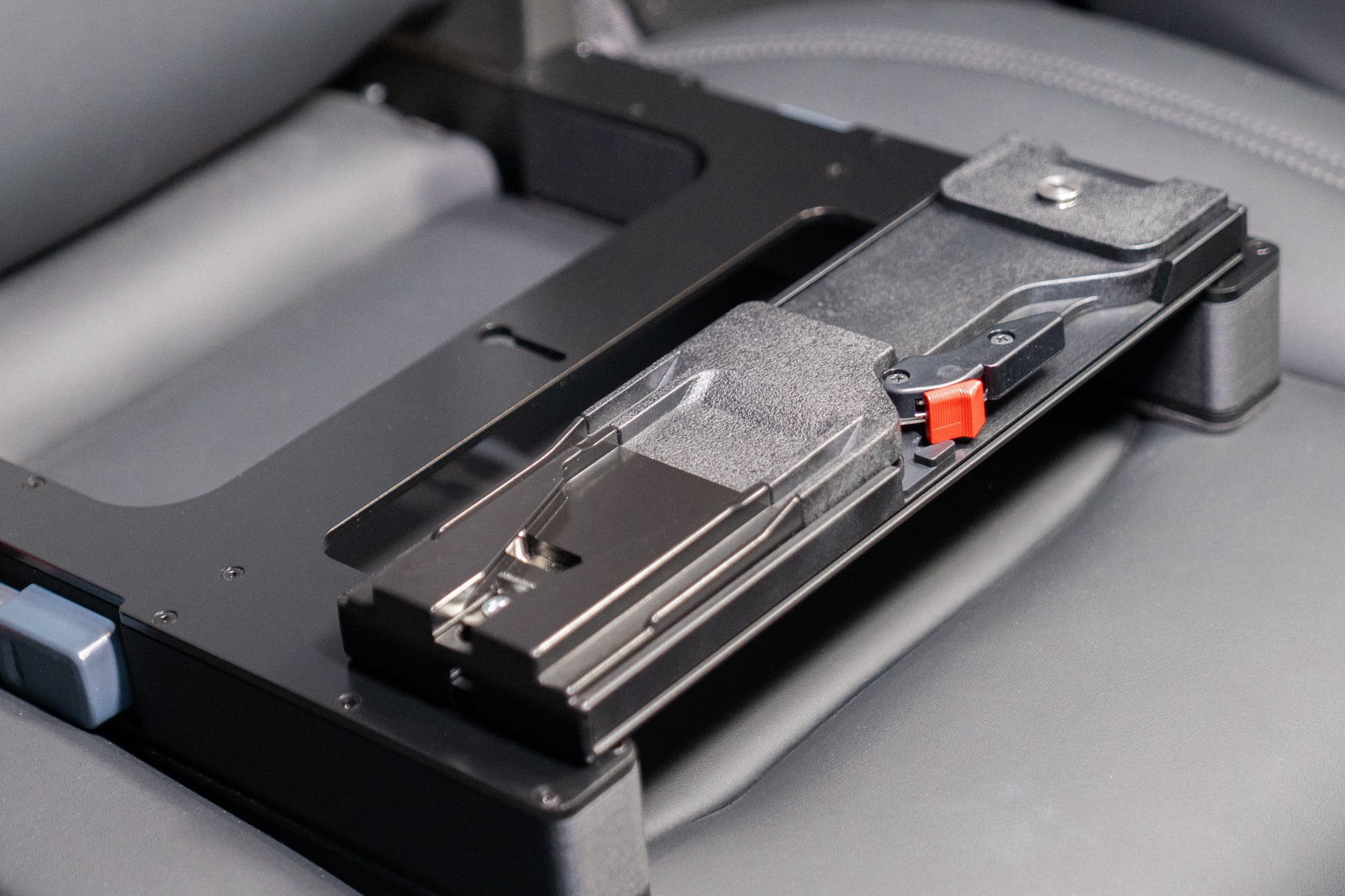 Close-up of a VCT-14 quick release plate mounted on The Gearseat